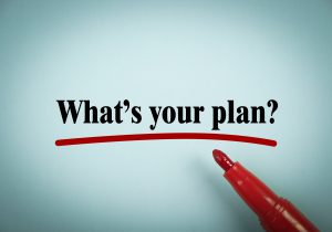 What is your plan text is written on blue paper with a red marker aside.